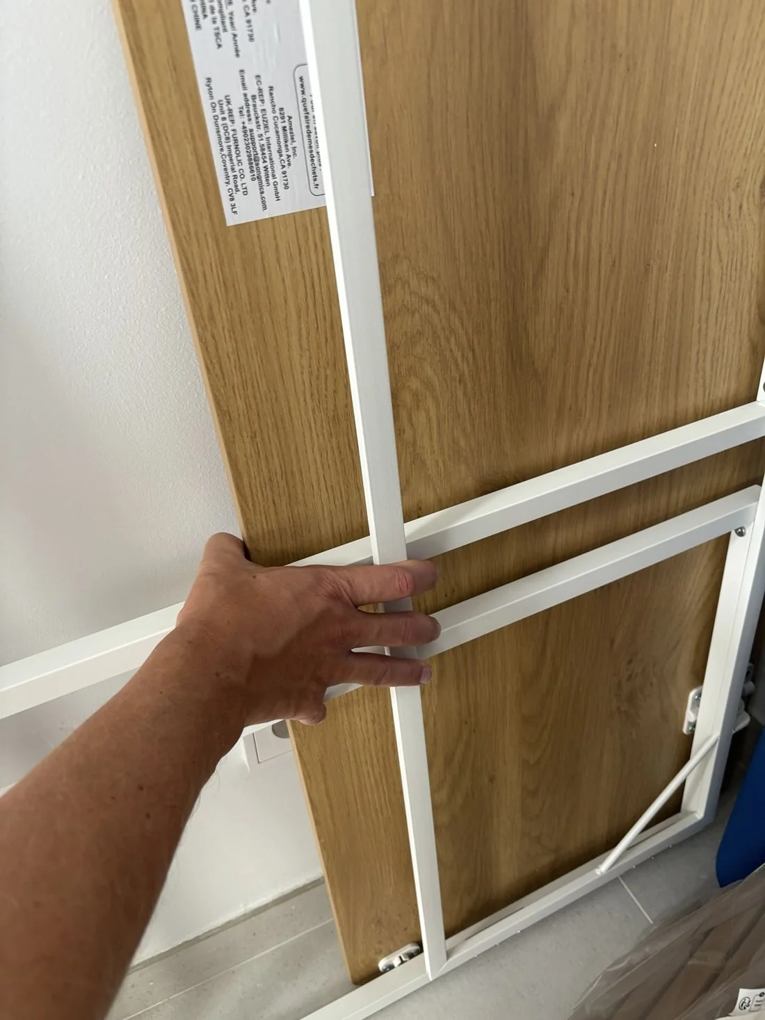 Folding work table stored flat